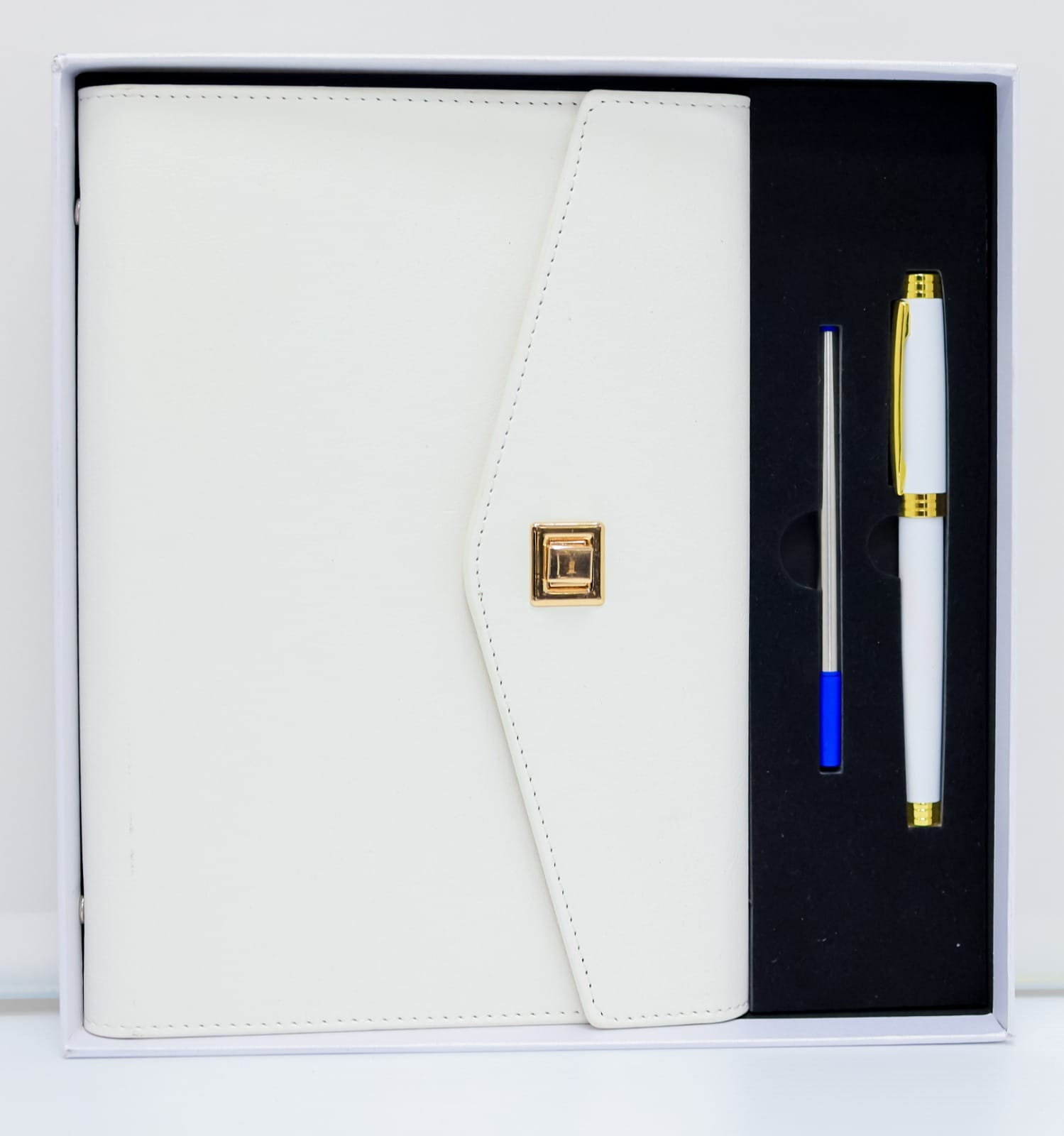 This Executive Gift Set features a sleek and sophisticated white leather notebook, complete with a matching pen neatly tucked inside. The high-quality leather gives the notebook a luxurious feel, making it the perfect accessory for any professional setting.