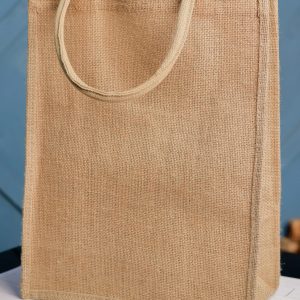 This eco-friendly jute shopping bag is the perfect accessory for your next trip to the grocery store or farmer's market. Made from sustainable materials, this sturdy bag is not only stylish but also durable enough to carry all your essentials.